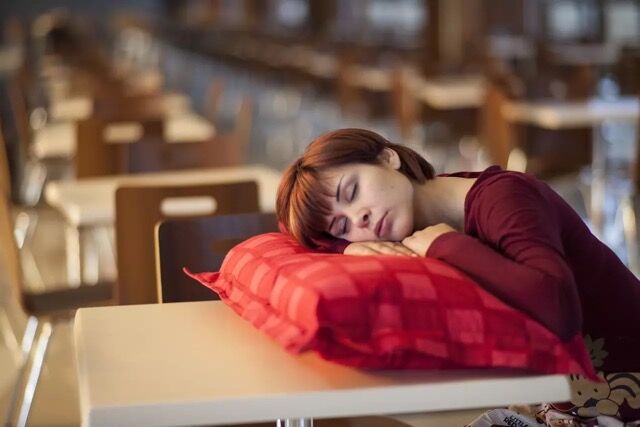 Woman sleeping on pillow