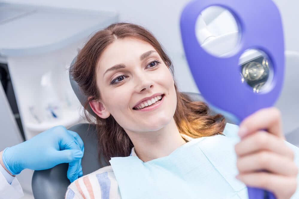 Smiling woman at dentist